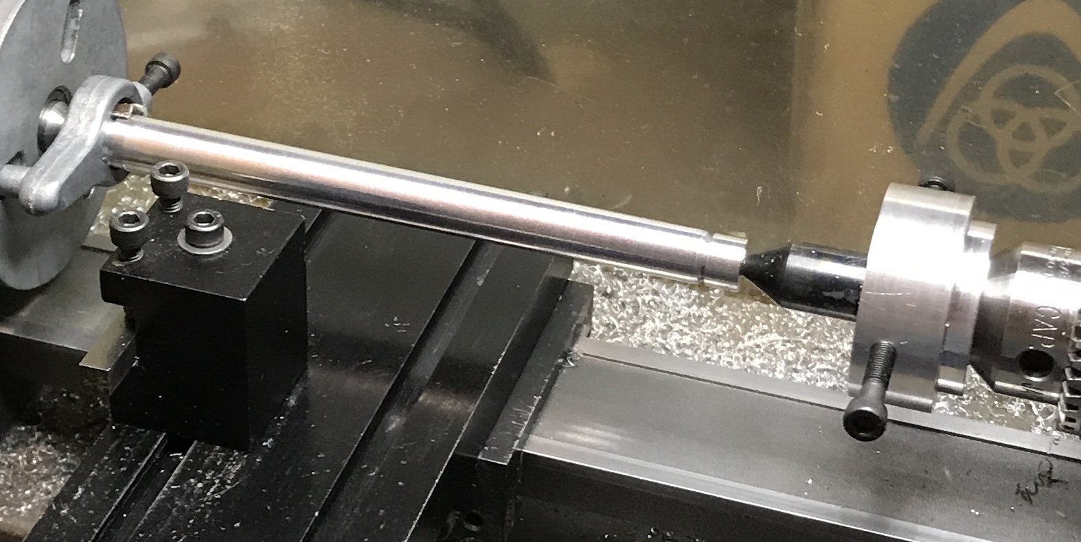 A tailstock offset holding the new center